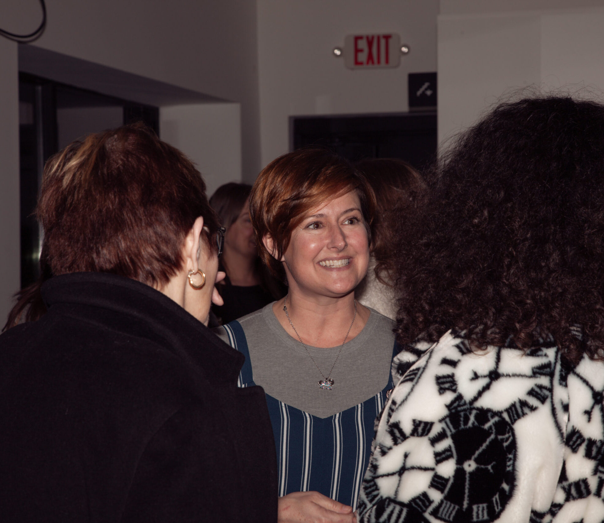 Two karaoke singers enjoy a lively duet at a local tavern during a RoLo Entertainment-hosted karaoke night.